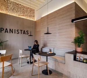 A cozy restaurant with comfortable seating areas, wooden furniture, and a relaxed atmosphere