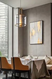 A formal dining area with a large table surrounded by chairs, wine glasses, and utensils, set in a sophisticated and inviting atmosphere