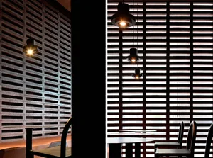 Dining area with a wooden table surrounded by metal chairs in a cozy and inviting space
