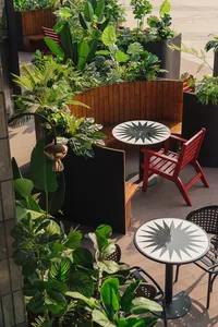 Cozy dining space with a wooden table featuring a star pattern design, surrounded by two chairs