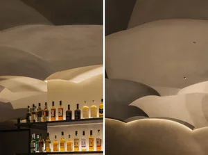 A well-stocked bar with wooden accents, bottles, and a cozy atmosphere, perfect for socializing and enjoying drinks