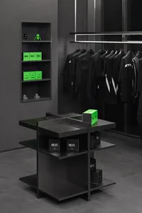 A modern store display featuring black shirts on mannequins, with a well-organized atmosphere and focus on clothing products