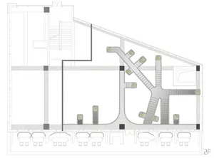 A modern interior space with multiple levels, featuring chairs and a focus on functionality and comfort