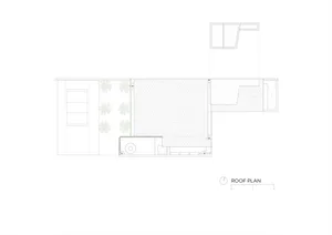 White floor plan drawing of a modern home with a living area, kitchen, bedroom, and bathroom, featuring furniture and clear dimensions
