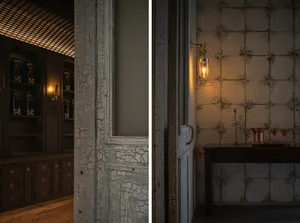 A cozy dining area with a table and chairs, surrounded by walls with a tiled design