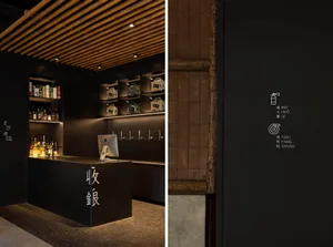 Modern bar area with a counter, TV, and bottles, with a focus on functionality and organization