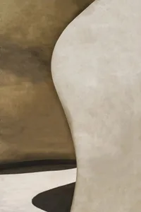 A smooth white wall in a room with no discernible elements or materials