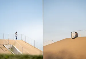 A modern metal staircase with a ramp, set in a calm and peaceful environment with no signs of activity