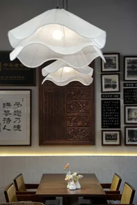 Cozy Asian restaurant interior with a wooden table, hanging lamp, and decorative elements, featuring a fusion of traditional and modern styles