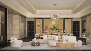 Inviting living space with a white couch, dining table, chairs, and decorative vases, featuring a sophisticated atmosphere and comfortable seating arrangement