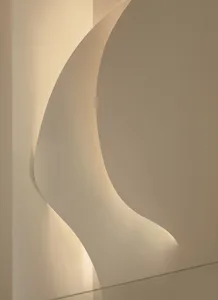 A minimalist abstract wall art piece featuring a curved design in a white background
