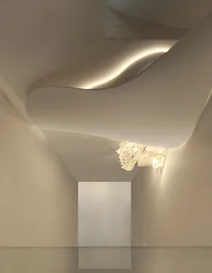 A modern interior design concept featuring a white staircase with a wooden handrail, curved stairs, and two lights on either side of the stairwell