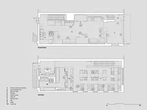 2D floor plan of a hotel with hardwood flooring, paintings on the walls, and dim lighting