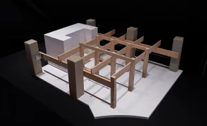 Black and white architectural model of a traditional house floor plan with wooden structures and a focus on functionality and simplicity