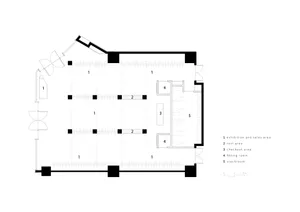 2D floor plan of a modern museum with chairs, a large hallway, and well-lit rooms