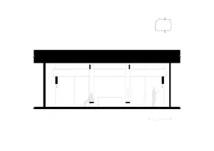 A spacious office space with natural light, featuring three individuals walking around, with a warm and inviting atmosphere