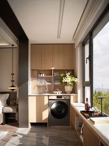 Clean modern kitchen with wooden cabinets, white walls, and wooden floors, featuring a sink, washer dryer combo, and window, with decorative elements like potted plants and vases