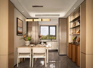 Bright and inviting dining space with white walls, a dining table, chairs, and natural light from windows