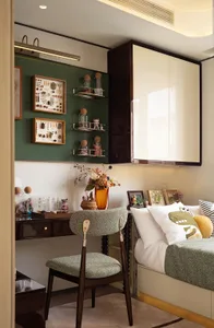 Cozy bedroom with a bed, chair, and decorative items such as vases and bottles, creating a warm and inviting atmosphere