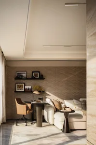 A well-lit living area with a couch, chair, dining table, and decorative items, featuring wood and fabric materials and a bookshelf