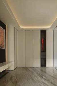 Empty modern room with white walls, a large window in the ceiling, and two white doors leading to another room