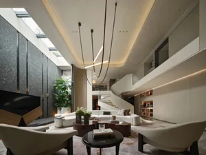 Open living area with a white couch, multiple chairs, potted plants, and a vase, surrounded by bright and inviting atmosphere