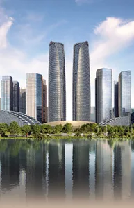 Two modern buildings with glass facades and steel frames, situated on a serene lake shore with surrounding water and natural scenery