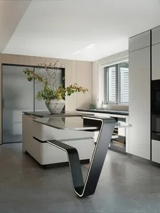 Modern kitchen with white cabinets and countertops, two sinks, and decorative vase, emphasizing functionality and simplicity
