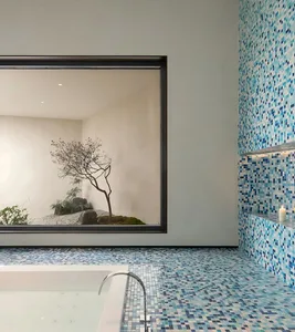 A serene bathroom with a freestanding bathtub near a window, surrounded by potted plants and a calming atmosphere