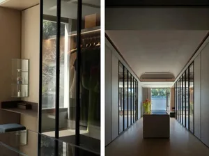 明亮溫馨的現代客廳空間，設有玻璃牆、沙發、椅子與餐桌，周圍環繞花瓶與裝飾元素