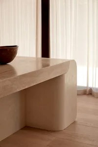 A modern kitchen countertop made of marble with a bowl placed on its surface