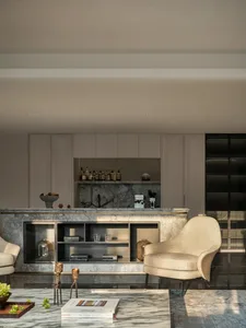Cozy living room with a bar area, couch, chairs, and decorative items