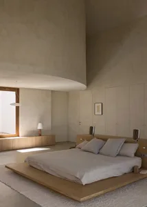 A modern bedroom with a wooden platform bed, nightstands, and lamps, creating a calm and inviting atmosphere