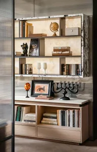 A well-organized bookshelf filled with various books of different sizes, arranged in an orderly manner on a wooden bookshelf in a cozy and intellectual environment