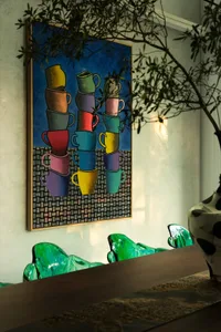 A colorful and imaginative painting of stacked cups in various positions, showcasing the artist's creative interpretation