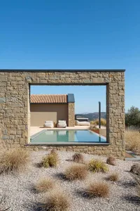 Architectural rendering of a modern house with a stone pool wall, two chairs, and a couch in a relaxing and inviting atmosphere