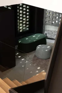 Cozy living area with two round ottomans, a rug, and two couches, a chair, and a window