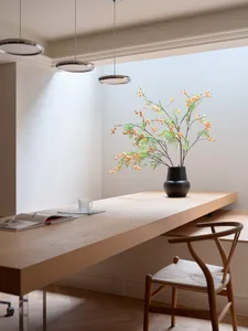 A cozy dining space with a wooden table and chairs, surrounded by warm tones and a relaxed atmosphere