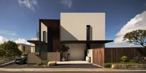 A modern house with a white exterior wall and gray roof, surrounded by potted plants and vases, well-lit by natural sunlight or artificial lighting