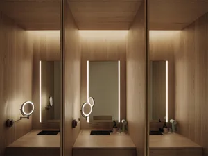 Modern bathroom with three mirrors, a sink, and a toilet, featuring a predominantly wooden design and soft, diffused lighting