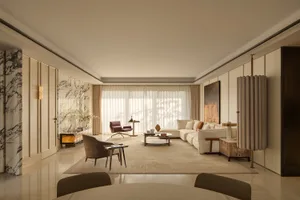 Spacious living room with a white couch, chair, and dining table, well-lit by natural light through windows, with a rug adding warmth and texture