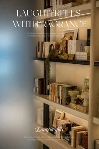 A wooden bookshelf in a cozy living room with books and decorative items arranged in a visually appealing way