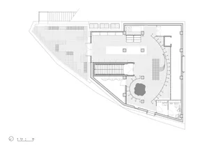 White floor plan with modern building layout, open and enclosed areas, and natural light from windows and doors