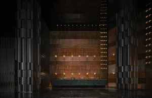 Well-lit bathroom with a wooden wall, a long countertop, sink, and mirror, and several lights