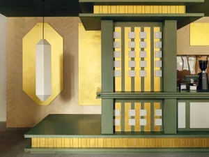 Cozy living room with a green and gold color scheme, featuring a gold wall design, green and gold fireplace, and matching ceiling