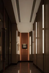 A dimly lit hallway with wooden walls, a brown color scheme, and a painting on the wall adds an artistic touch