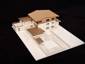 Two-story house floor plan with brown roof, featuring a living room, kitchen, dining room, bedroom, and bathroom, with natural lighting and warm atmosphere