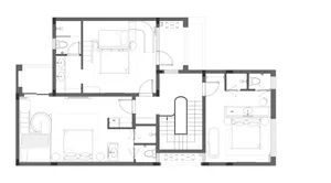 Black and white floor plan of a house with a living room, kitchen, and dining room, featuring linework, labels, and measurements