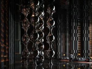 A modern living space with glass balls, chairs, a couch, and a person, featuring a contemporary and minimalist style with a focus on glass and reflective surfaces, in a dimly lit atmosphere