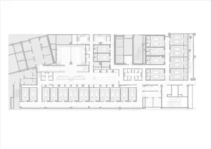 White floor plan of a modern hotel with rooms and connections, well-lit and organized for efficient space use